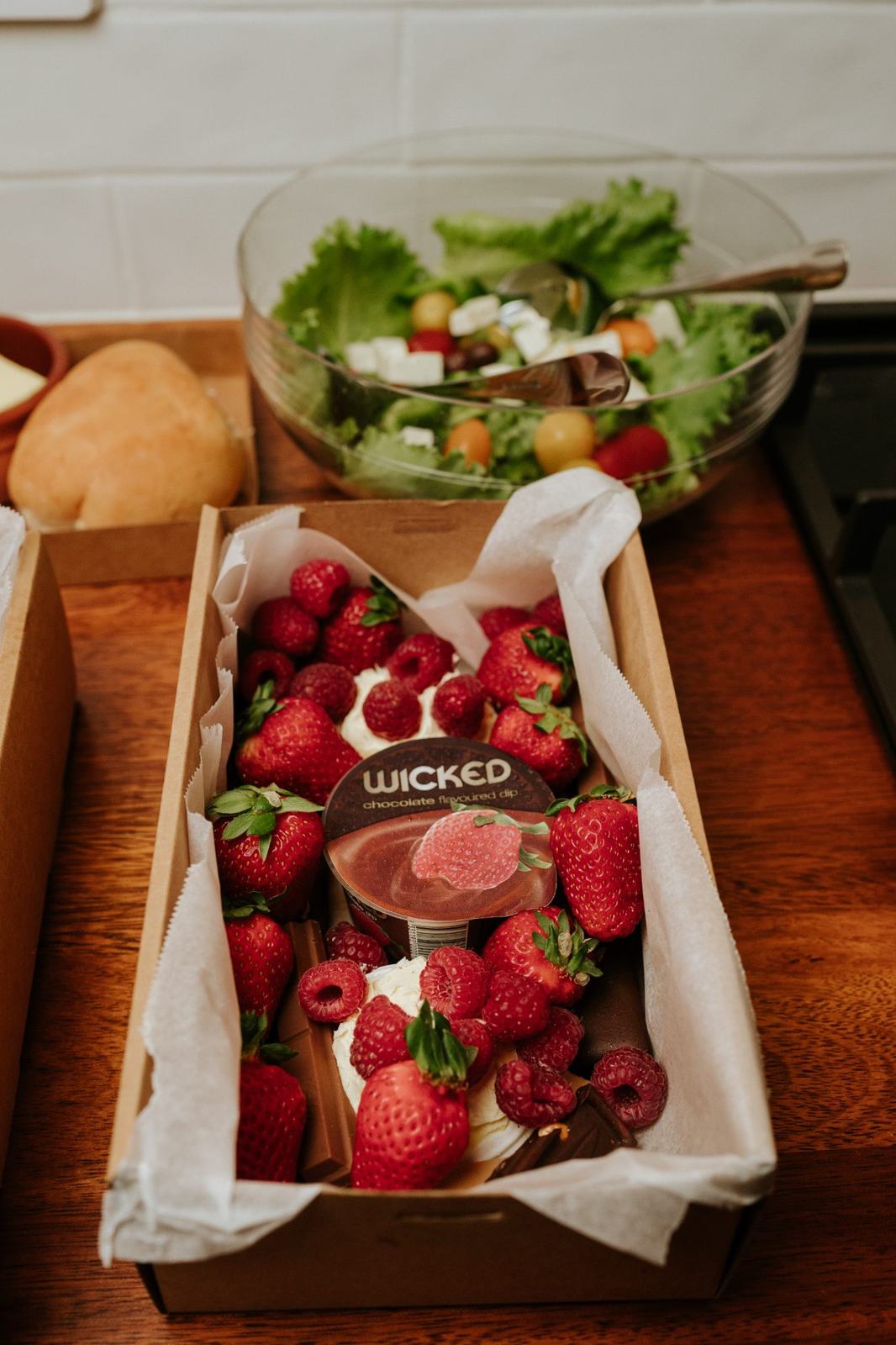 A dessert box of strawberries, raspberries and chocolate