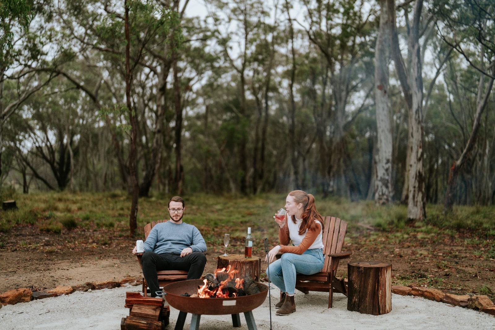 Dining beside the fire pit in the bush at dusk