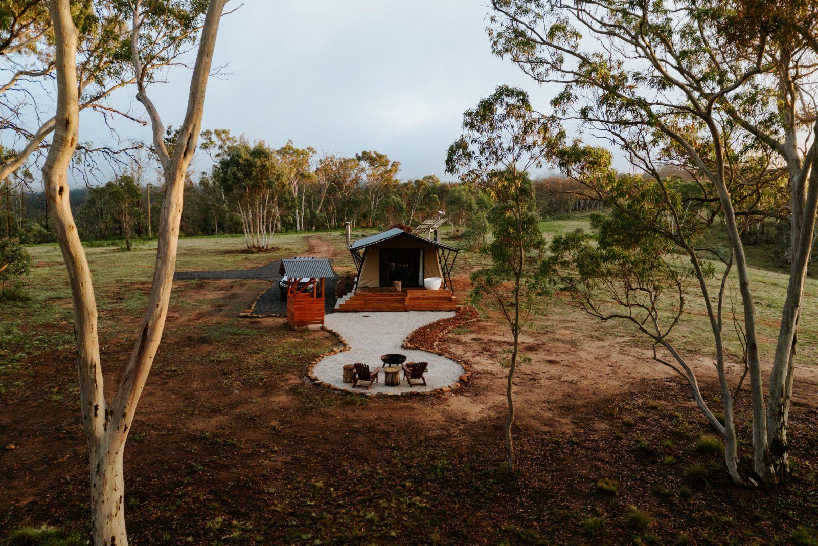 Akuna Estate's glamping tent in its bushland clearing, seen from above