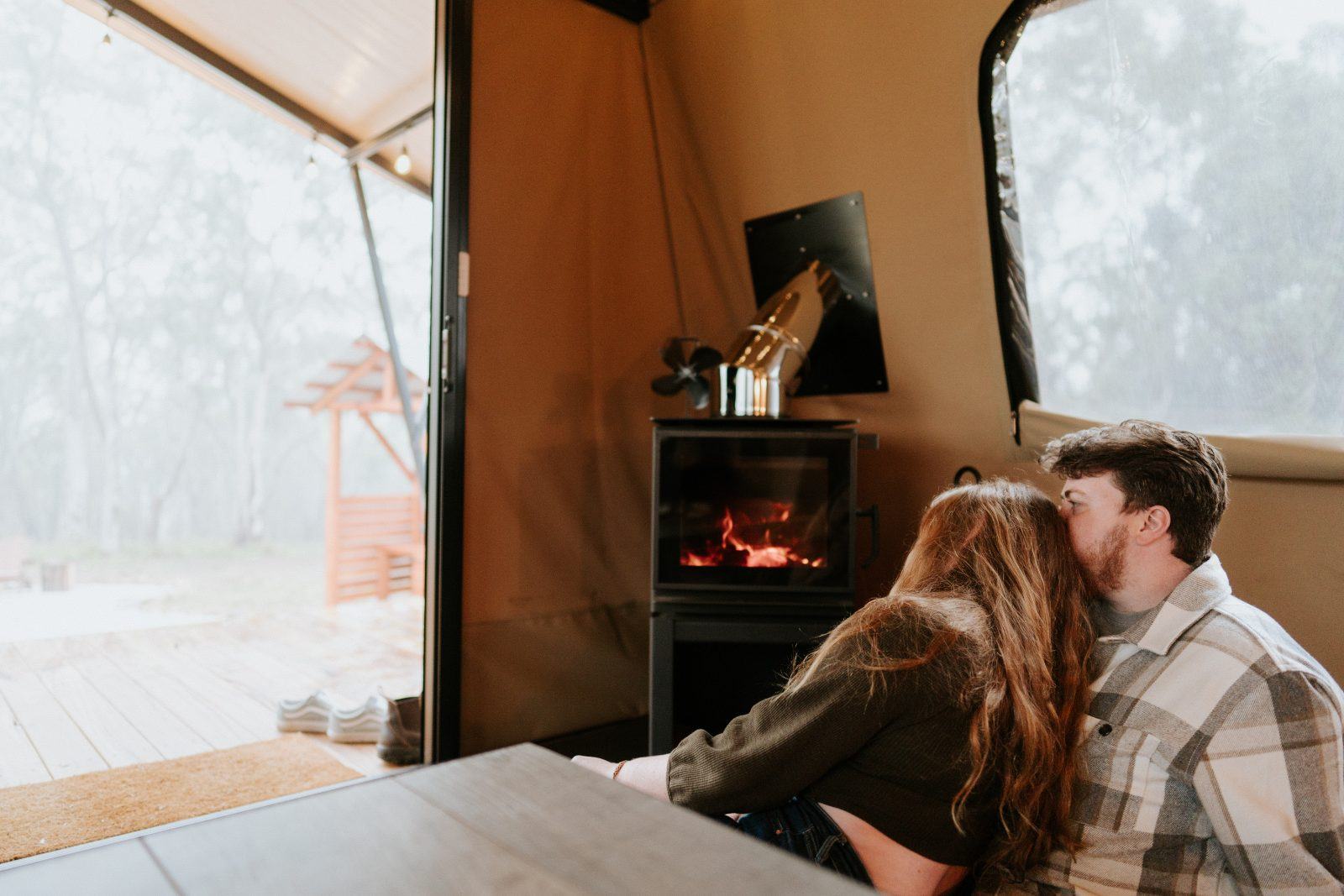 Settling in beside the wood-fire stove